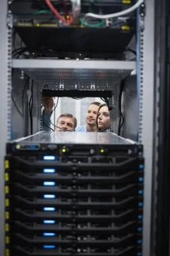 Technicians looking into servers Stock Photos