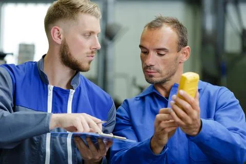 Technicians measure contract resistance in control panel Stock Photos