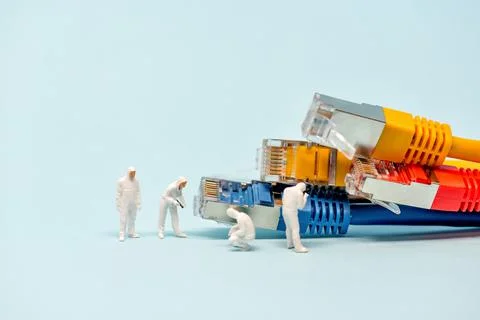 Technicians with multicolored network cables Stock Photos