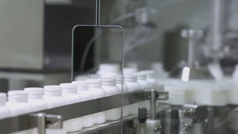 Technicians operate production machinery Stock Footage 98406880