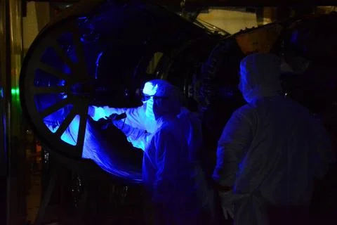 Technicians perform a black light inspection of the Northrop Grumman Pegas... 스톡 사진