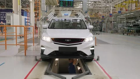 Technicians perform final quality control on a Belgee X50 SUV Stock Footage 318183731