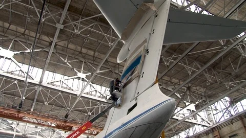 Technicians perform maintenance of elevator of Il-76 aircraftat high altitude. Stock Footage 108700220