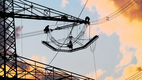 Technicians perform work on a high-voltage pylon at great heights Video stock 163083563