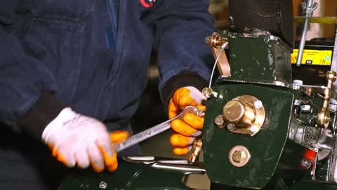 Technicians Performing Mechanical Assembly and Maintenance on Engine Unit Video stock 308043225