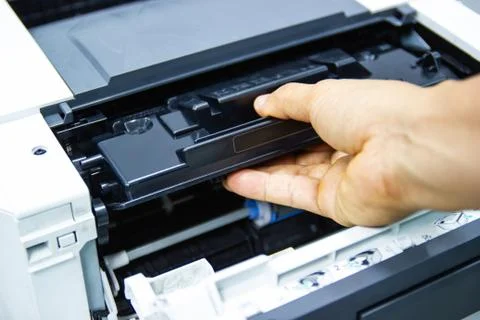 Technicians replacing toner in laser printer concept office supplies repair 库存照片