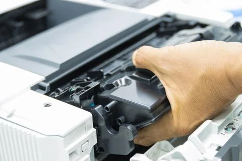 Technicians replacing toner in laser printer concept office supplies repair 库存照片