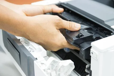 Technicians replacing toner in laser printer concept office supplies repair Photos