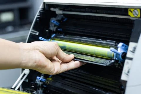 Technicians replacing toner in laser printer concept office supplies repair Photos