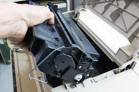 Technicians replacing toner in laser printer concept office supplies repair 库存照片