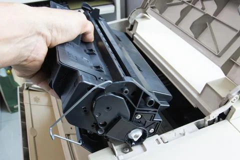 Technicians replacing toner in laser printer concept office supplies 스톡 사진