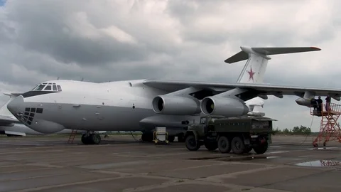 Technicians stand on ladder and do maintenance work on UPAZ on Il-78. Stock Footage 108430074