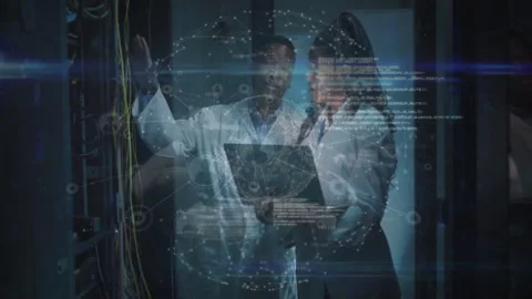 Technicians touching cable port, adjusting laptop showing rotating globe code Stock Footage 311901043