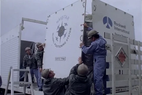 Technicians uncrating satellite on flatbed trailer - 1979-1980 Stock Footage 103841239