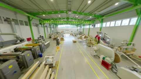 Technicians work with equipment in paper plant workshop FPV Stock Footage 291337319