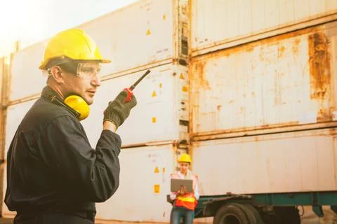 Technicians work with field radios and teamwork. Stock Photos