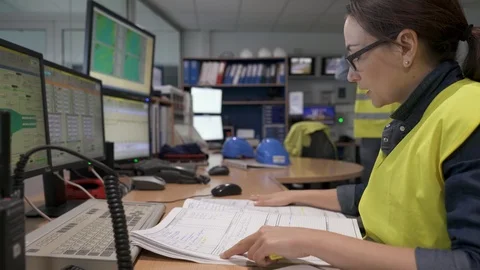 Technicians working in industrial plant control room Video stock 89466209
