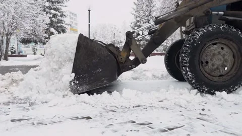 Technique clears snow from the streets of the city. Winter. City snow removal Video stock 165855860