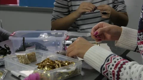 Technique of handmade jewelry on workshop, hands in foreground and background. Stock Footage 55839902