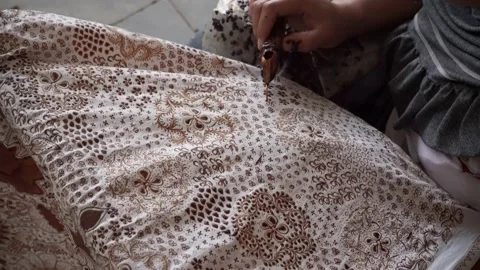 The technique of making batik by writing using a canting tool. Stock Footage 169933921