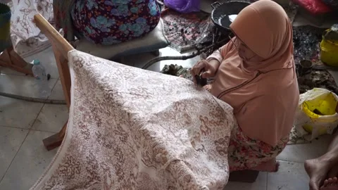 The technique of making batik by writing using a canting tool. Stock Footage 169933934