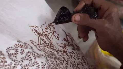 The technique of making batik by writing using a canting tool. Stock Footage 169934233