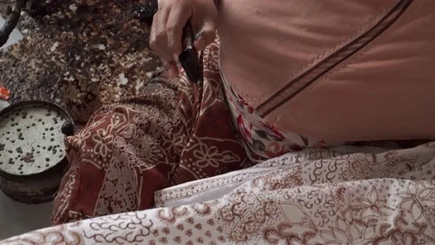 The technique of making batik by writing using a canting tool. Stock Footage 169934267