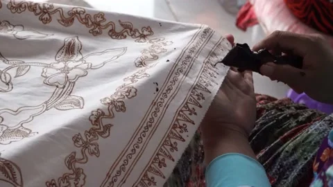 The technique of making batik by writing using a canting tool. Stock Footage 169934382