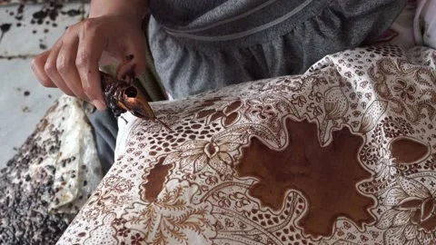 The technique of making batik by writing using a canting tool. Stock Footage 169934537
