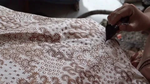 The technique of making batik by writing using a canting tool. Stock Footage 169934702
