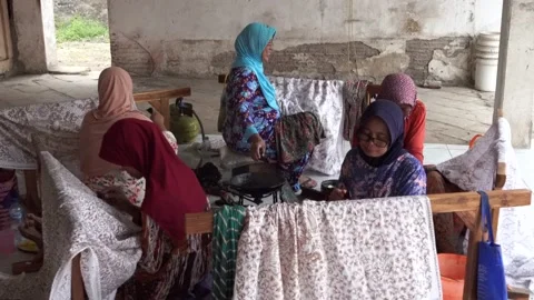 The technique of making batik by writing using a canting tool. Stock Footage 169934849