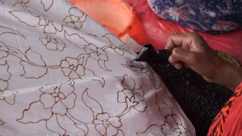 The technique of making batik by writing using a canting tool. Stock Footage 169934891