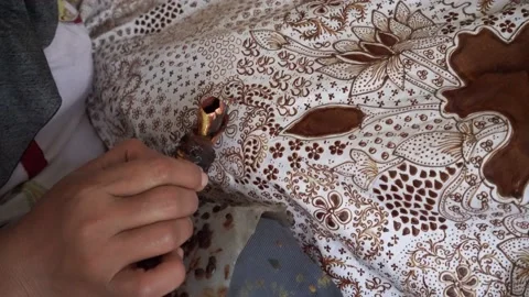 The technique of making batik by writing using a canting tool. Stock Footage 169935042
