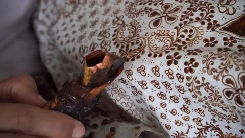 The technique of making batik by writing using a canting tool. Stock Footage 169935520