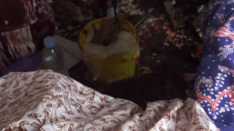 The technique of making batik by writing using a canting tool. Stock Footage 169935569