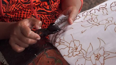 The technique of making batik by writing using a canting tool. Stock Footage 169935762