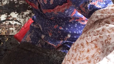 The technique of making batik by writing using a canting tool. Stock Footage 169935872