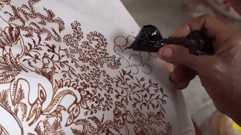 The technique of making batik by writing using a canting tool. Stock Footage 169935963