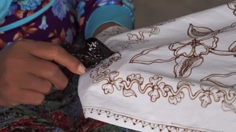 The technique of making batik by writing using a canting tool. Stock Footage 169936259