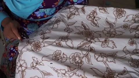 The technique of making batik by writing using a canting tool. Stock Footage 169936548