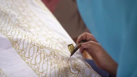 The technique of making hand-drawn batik using a canting tool. This Stock Footage 287562407