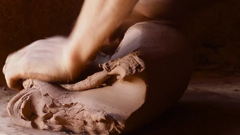 The technique of malaxation with hands of clay dough Stock Footage 124591893