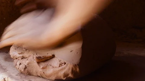 The technique of mixing the clay dough with hands  Stock Footage 124591892