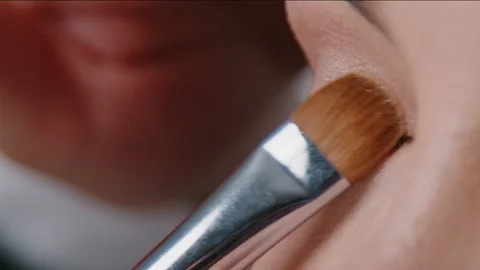 Techniques for Applying Makeup Effectively with a Brush A Detailed Closeup Stock Footage 327623083