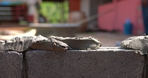 Techniques for cement masonry for the construction of building fences Stock Footage 132714741