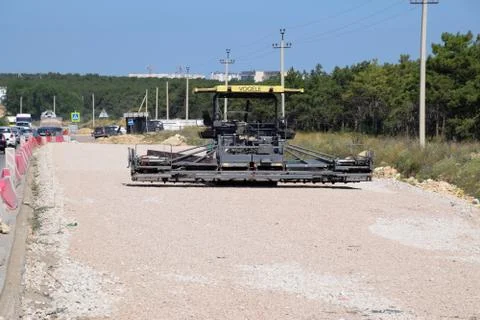 Techniques for construction of the road. Asphalt dispenser. Stock Photos