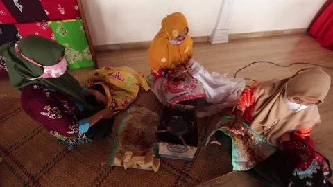 Techniques for Making Batik by Writing Using Canting Tools. Stock Footage 287304193