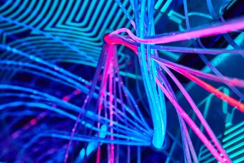Techno wires and cables of interlocking blue and pink techno LED lights 스톡 사진