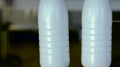 Technolofy of conveyor with milk bottles Stock Footage 58756754