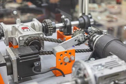 Technological assembly with interconnected components, gears, chains, metal.. Stock Photos
